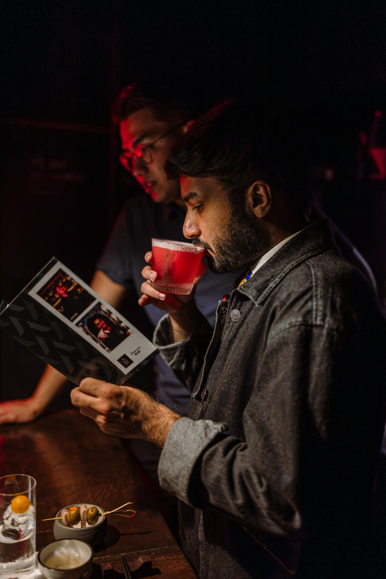 The Bunker Room, guest with cocktail
